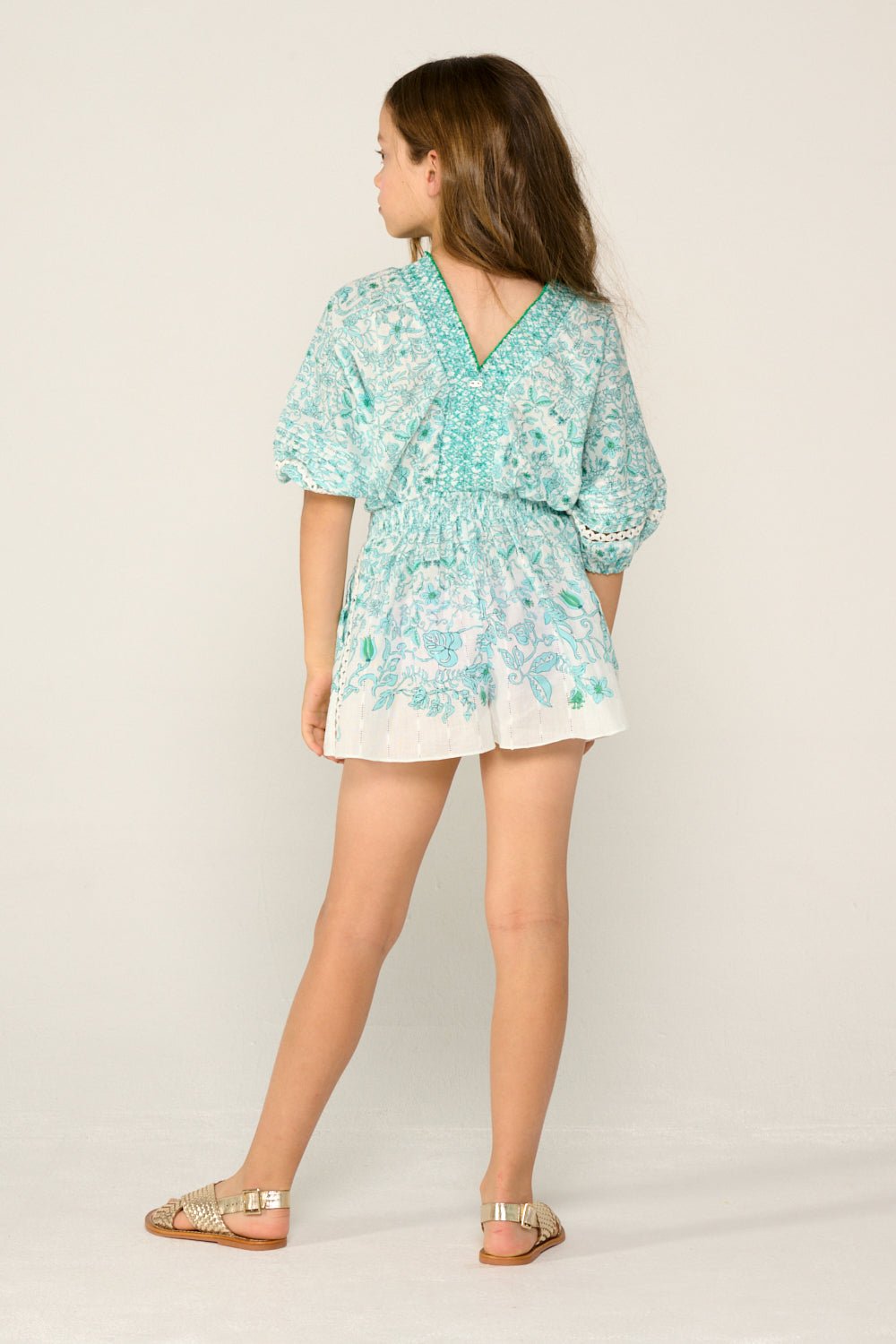 Girls' aqua short jumpsuit by Poupette St Barth, featuring a comfortable fit and stylish design, ideal for warm weather.