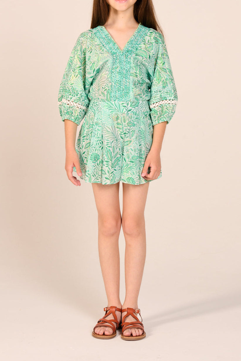 Green Palmarosa short jumpsuit for girls by Poupette St Barth, made of cotton with metallic accents, styled for casual wear.