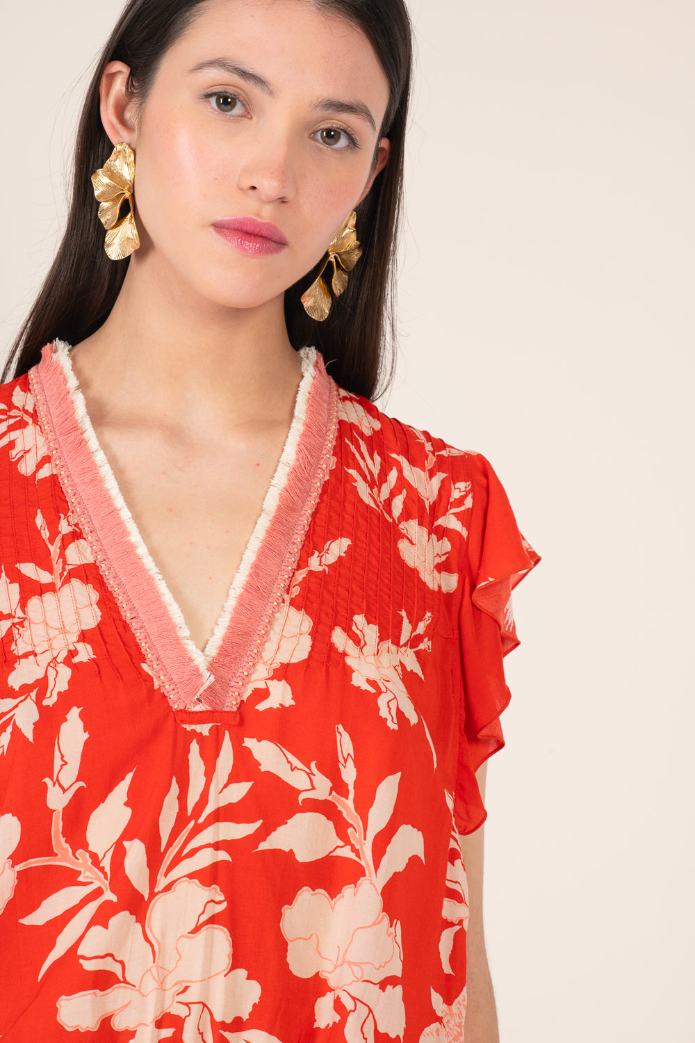 Poupette St Barth coral short jumpsuit with palm beach print featuring a fitted waist and stylish short sleeves.