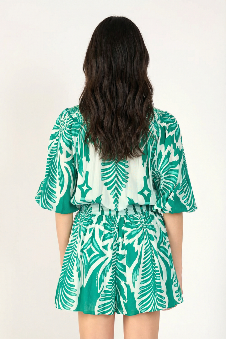 Back view of Poupette St Barth Janna mint short jumpsuit, featuring a relaxed fit and stylish design from the Cartagena collection.