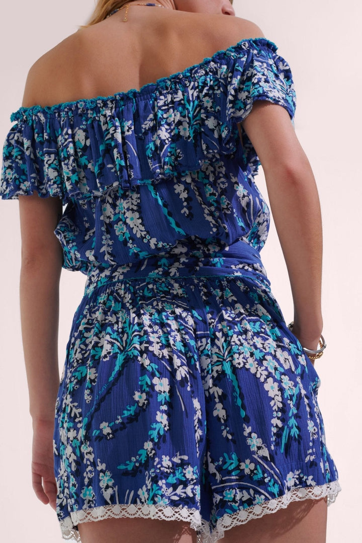 Poupette St Barth Short Jumpsuit Bella in Royal Palmery fabric, stylish sleeveless design with a relaxed fit and tropical pattern.