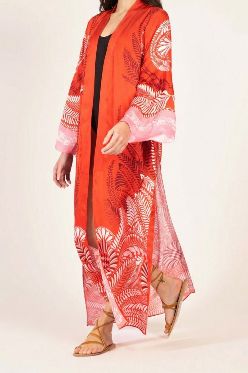 Poupette St Barth Kimono Lea in orange oolong satin cover-up with wide sleeves and relaxed fit, styled as a fashionable loungewear piece.