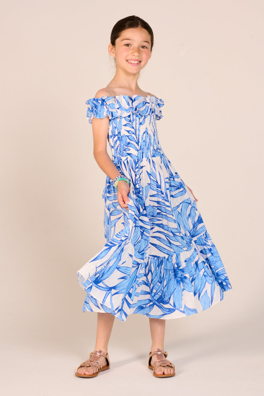 Girls' Blue Palm Leaf long dress – Long Dress Suzanne by Poupette St Barth, twirling to show the tiered skirt