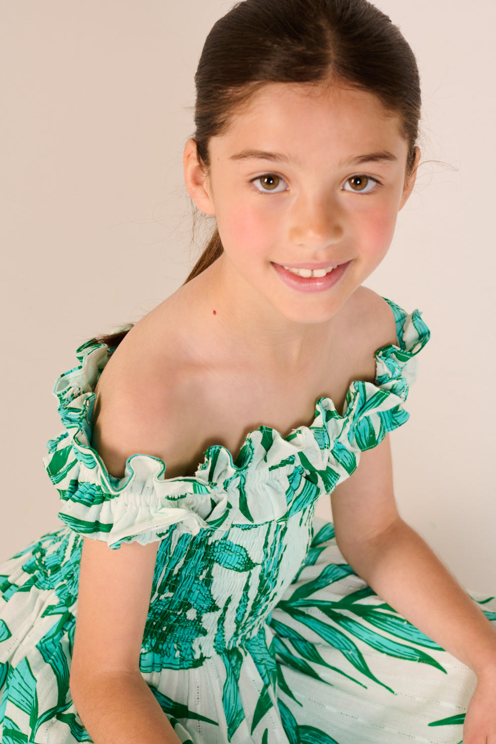 Girls' long green dress with palm leaf pattern by Poupette St Barth, featuring flowy fabric and elegant design.