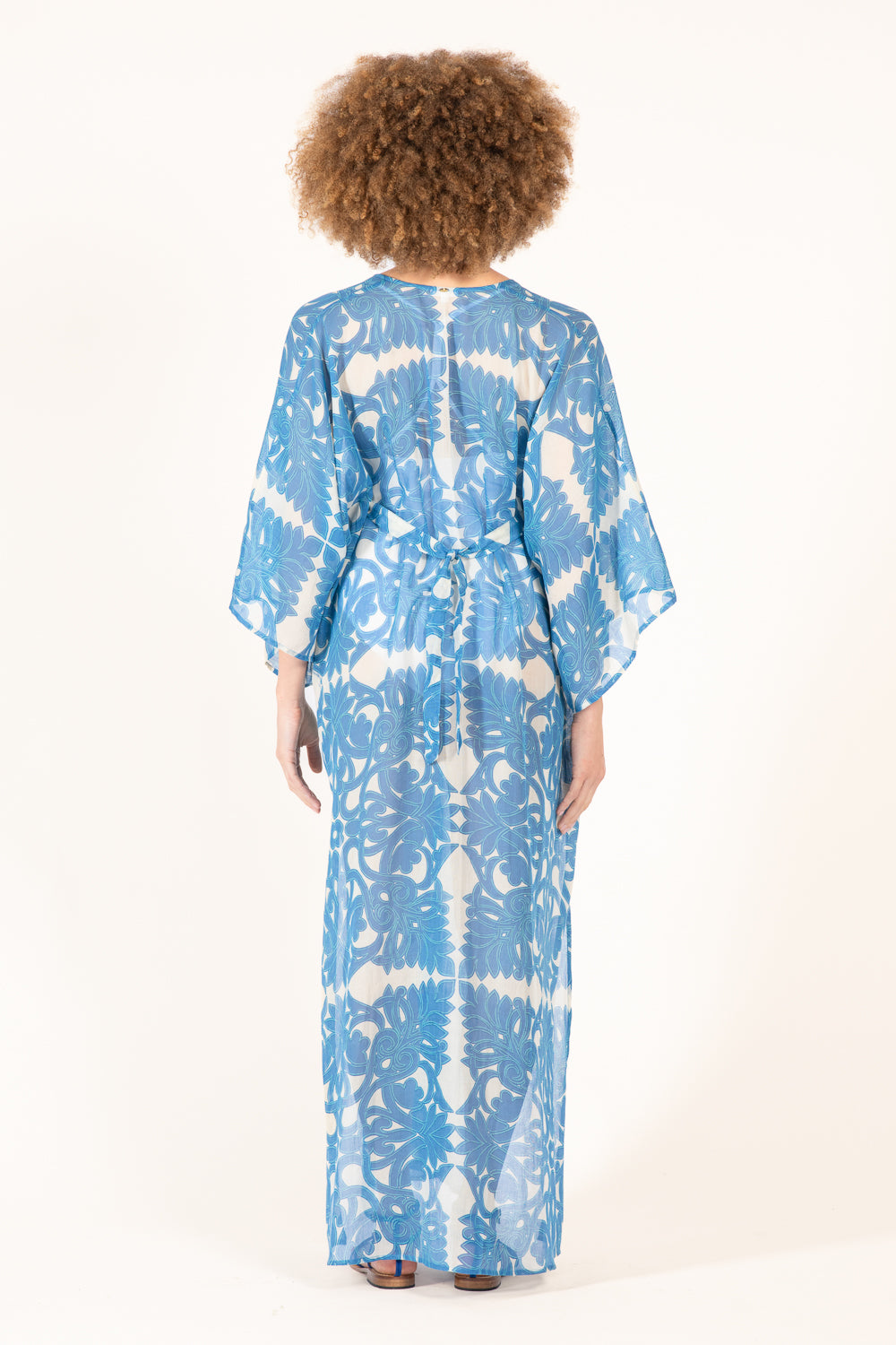 Blue long kaftan dress by Poupette St Barth, featuring flowing fabric and vibrant design, perfect for casual or beachwear.