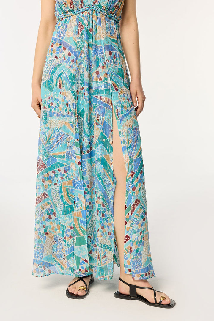 Blue mosaic long dress by Poupette St Barth, featuring flowing fabric and elegant design in this image.