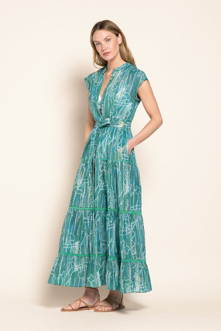Green long dress from the Poupette St Barth Kora collection, featuring flowing fabric and elegant design.