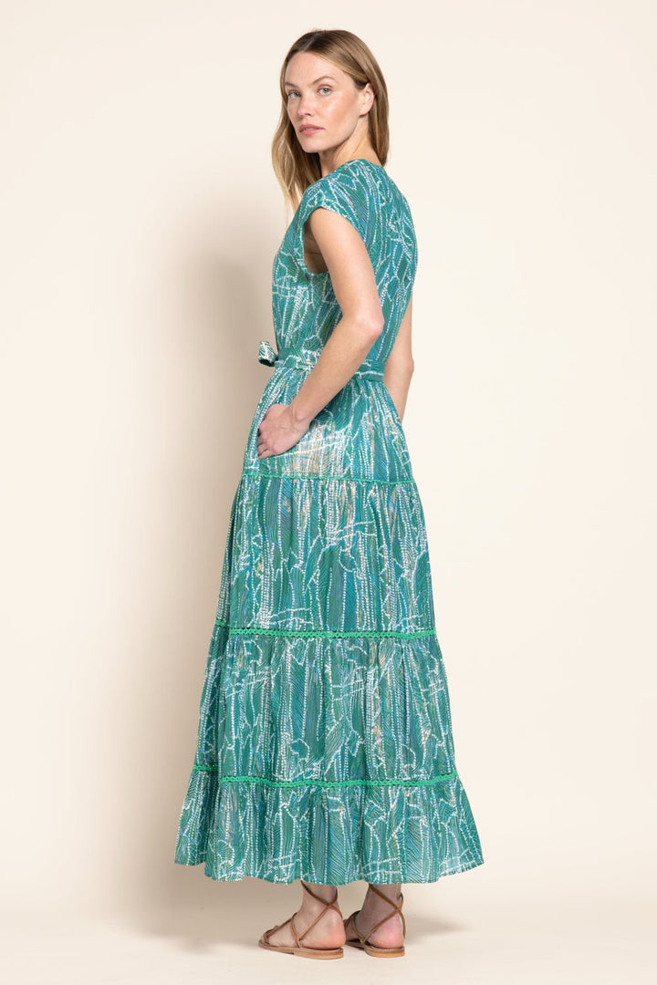Green long dress Kora by Poupette St Barth featuring flowing fabric and elegant design, perfect for stylish occasions.