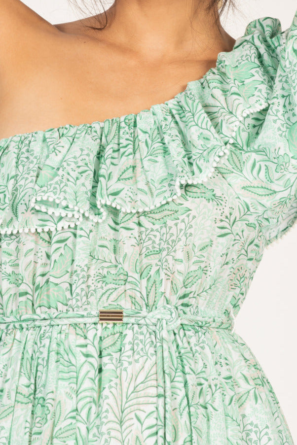 Green Palmarosa Long Dress by Poupette St Barth, made of lightweight cotton mousseline, shown on a model with a flowing silhouette.