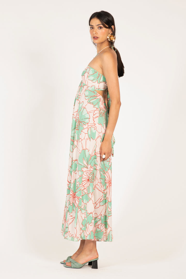 Long green petal print dress by Poupette St Barth, flowing fabric and elegant design for a stylish summer look.