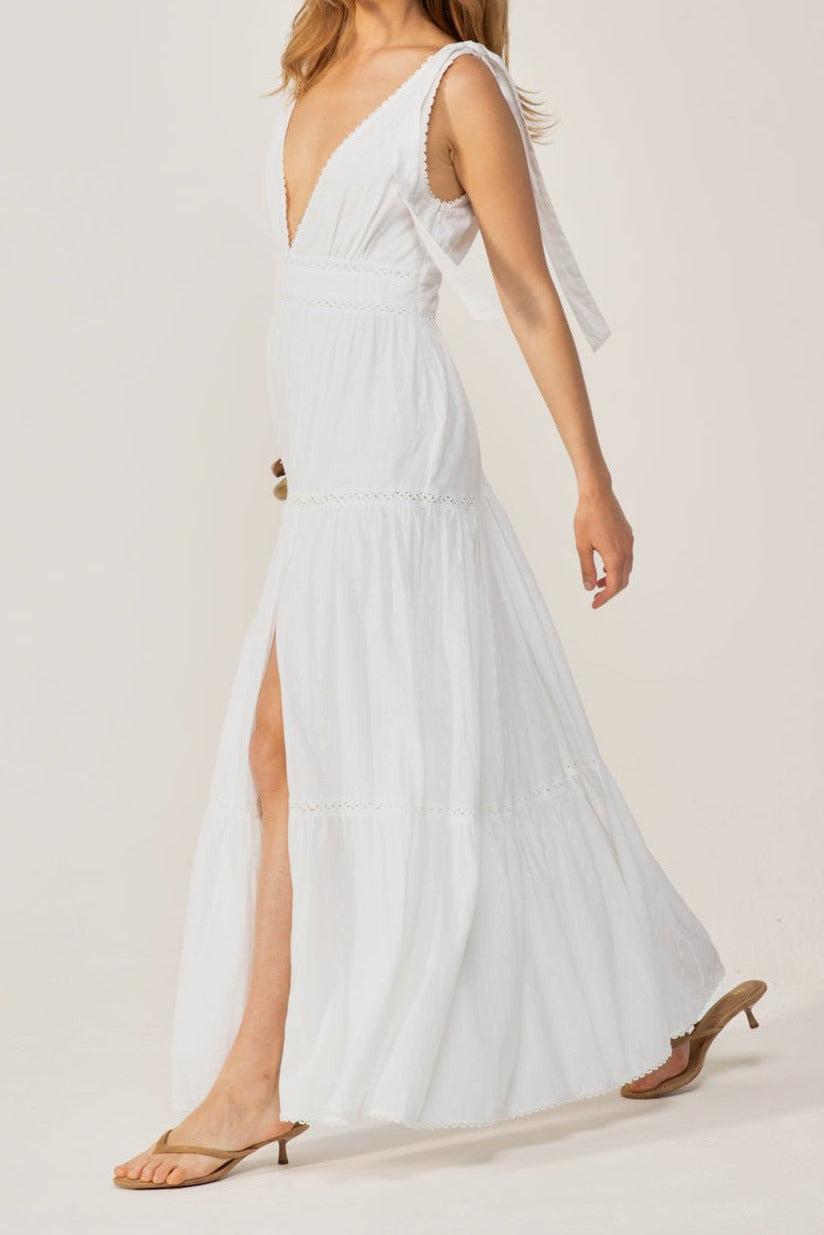 Natural White long dress – Long Dress Perla by Poupette St Barth, walking side view showing front slit