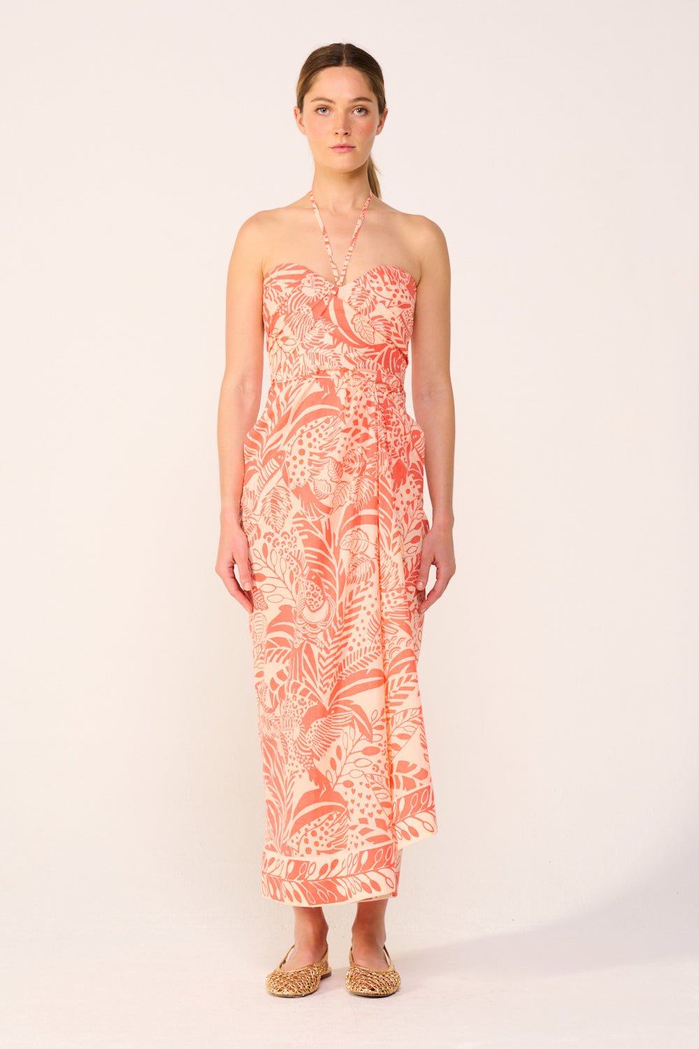 Orange Collina long dress by Poupette St Barth featuring a toucan print, flowing fabric, and elegant design.