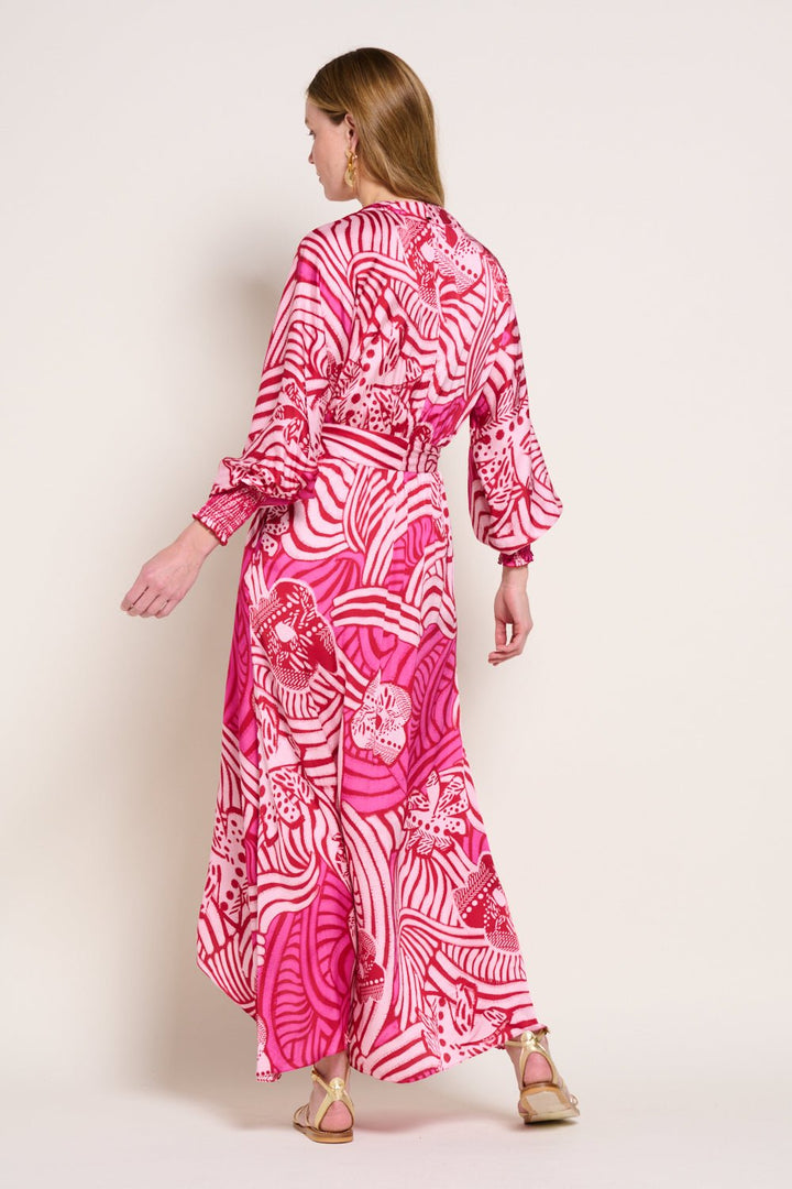 Pink long dress Kristen by Poupette St Barth with flowing fabric and elegant design, shown on a model.