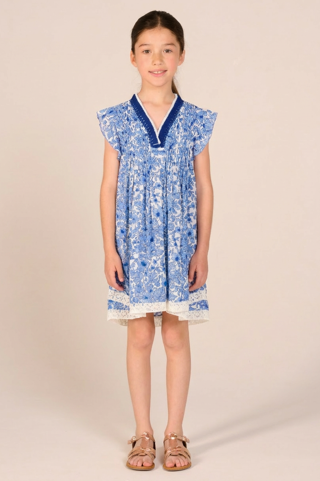 Blue Aquaflora mini dress for girls by Poupette St Barth featuring a stylish, lightweight design perfect for warm weather.