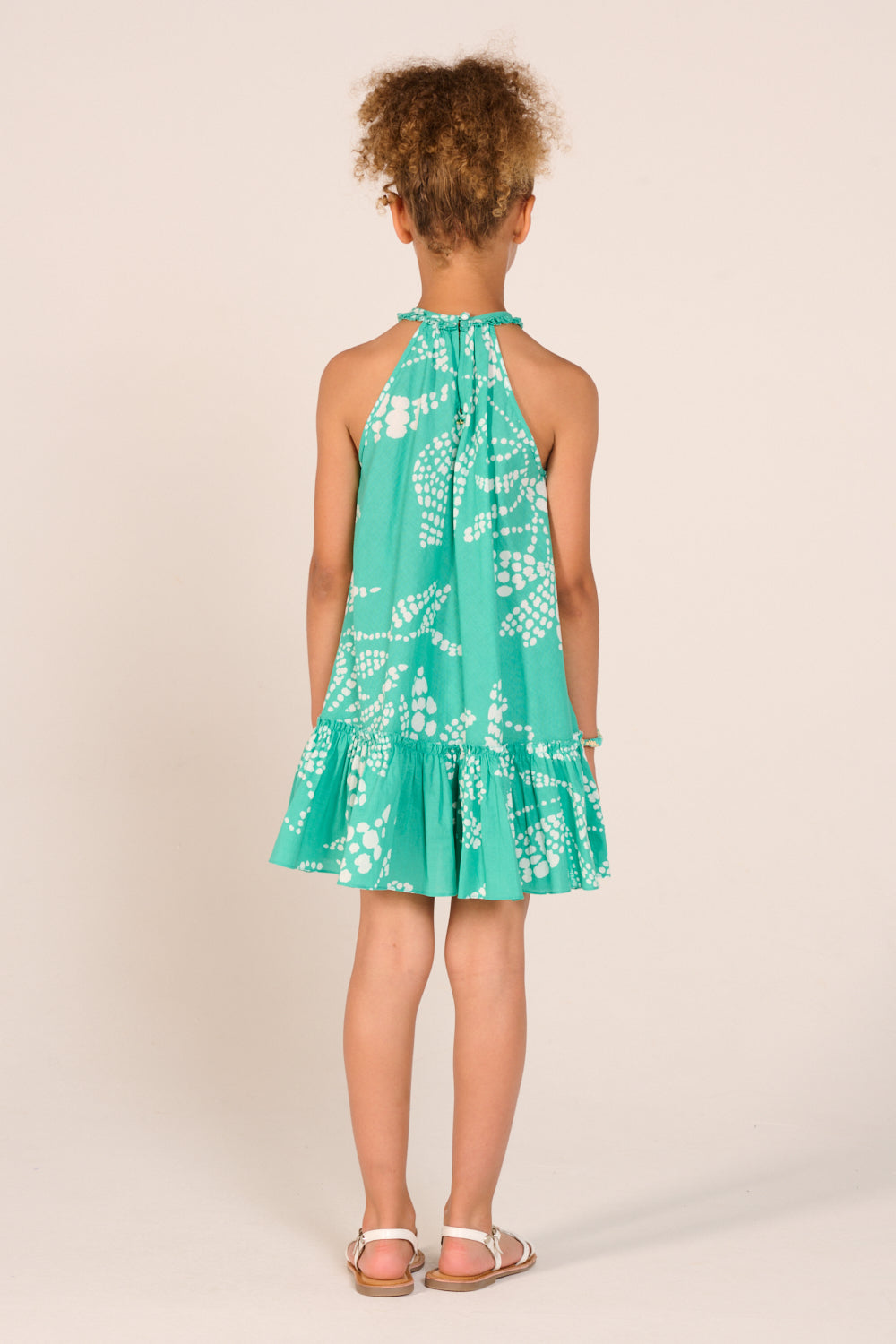 Girls' Mint Austral mini dress – Mini Dress Cleo by Poupette St Barth, back view of the flounced hem