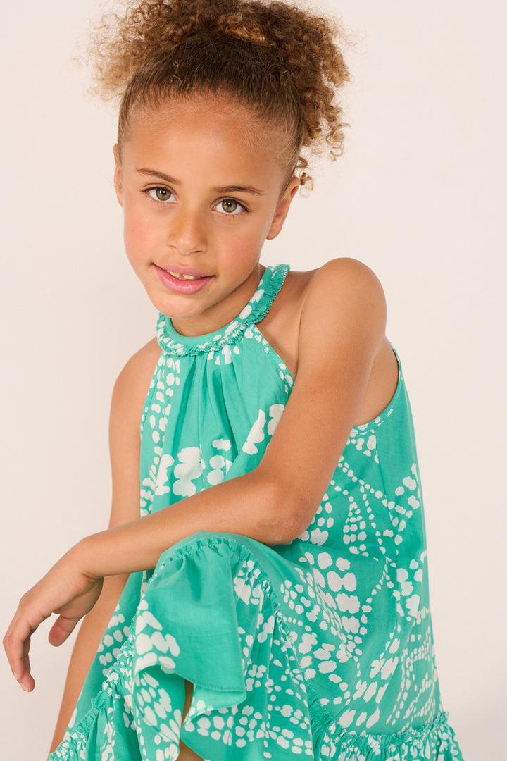 Girl wearing a mint green Mini Dress Cleo by Poupette St Barth, featuring a stylish, lightweight design for warm weather.