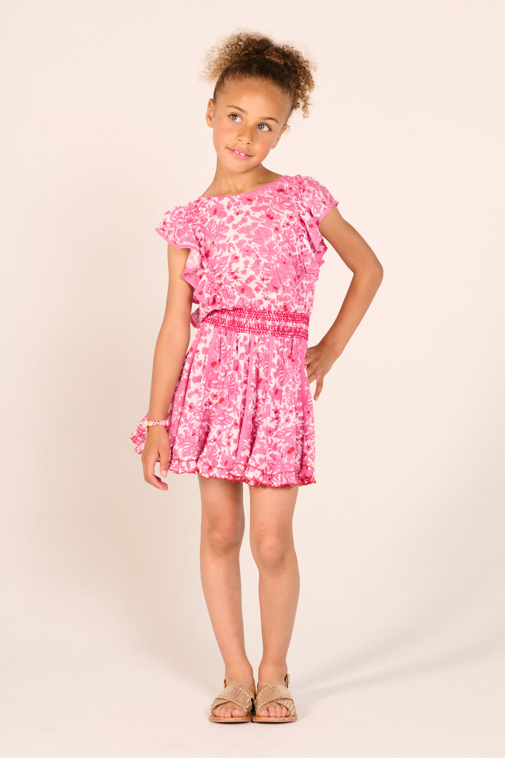 Pink Aquaflora mini dress for girls by Poupette St Barth, featuring a playful, colorful floral pattern and lightweight fabric.