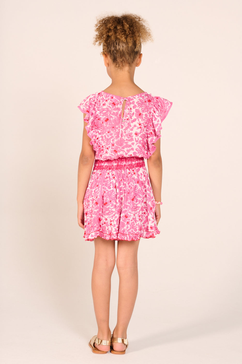 Pink aquaflora mini dress for girls by Poupette St Barth, featuring a floral pattern and lightweight fabric.
