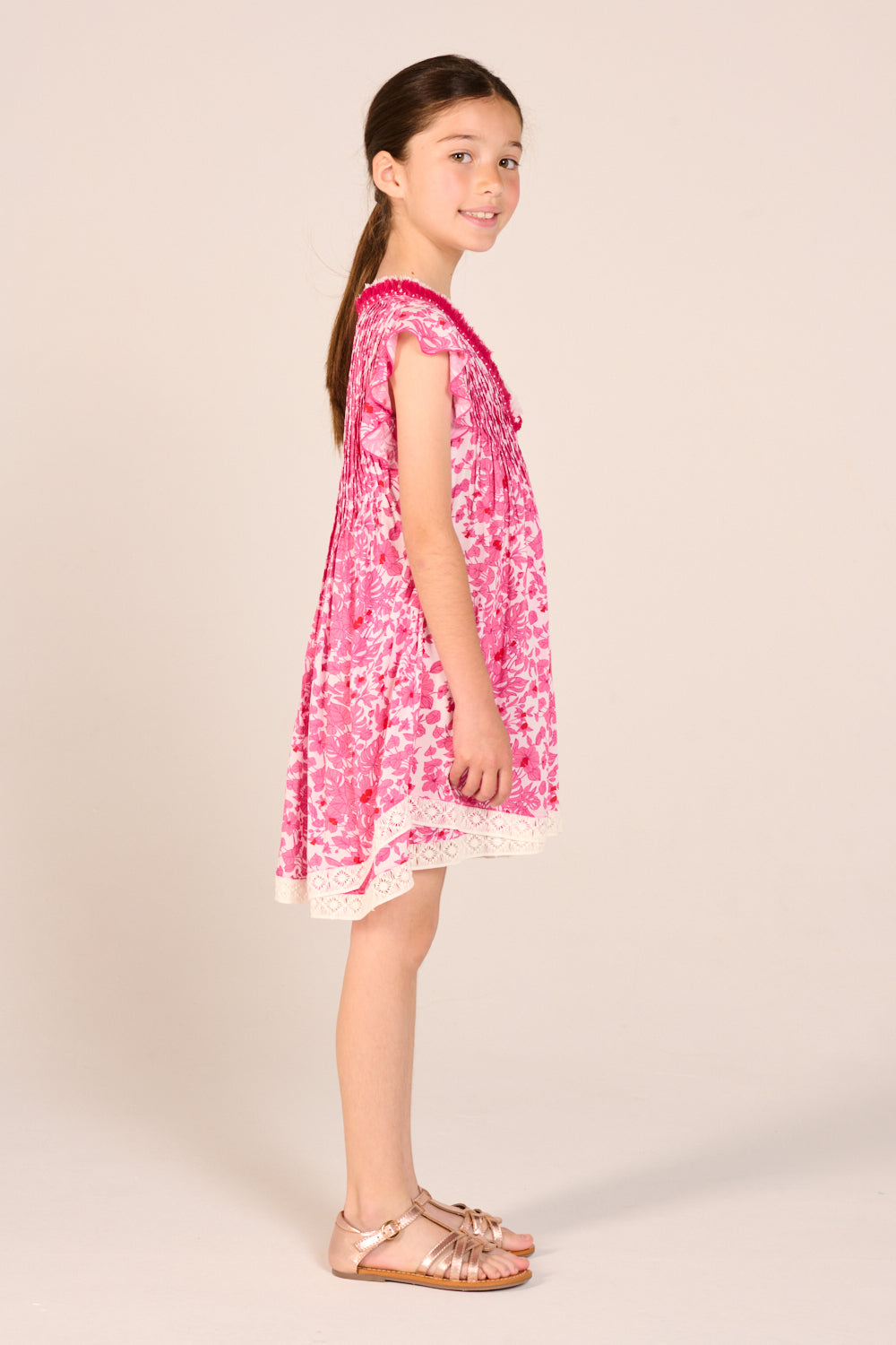 Girls' Pink Aquaflora mini dress – Mini Dress Sasha by Poupette St Barth, side view of the swing shape