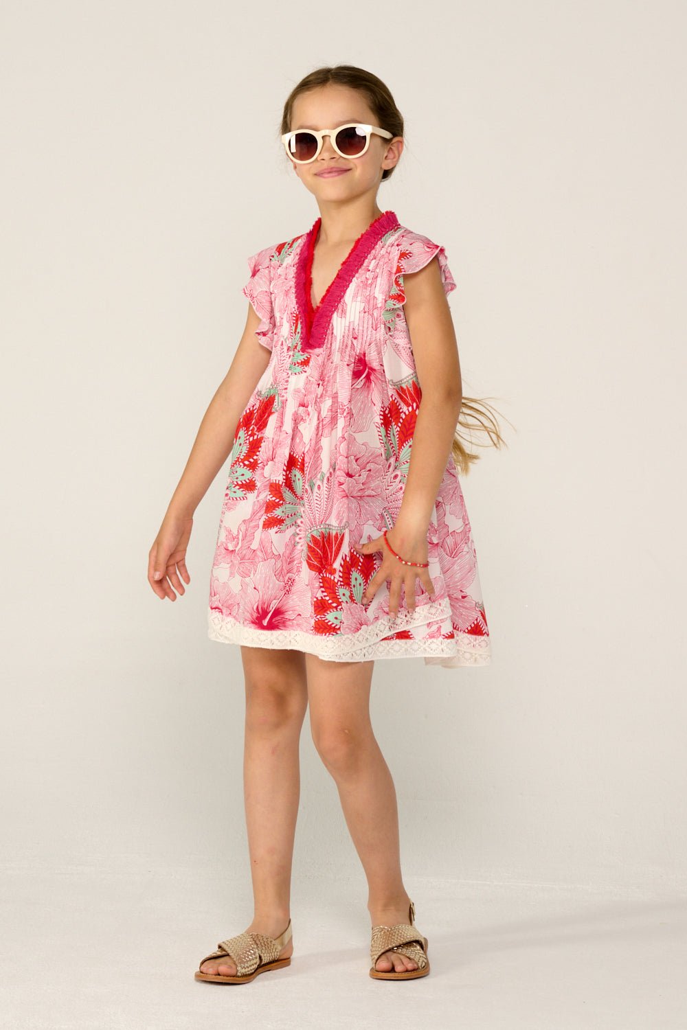 Girls' Pink Padang mini dress – Mini Dress Sasha by Poupette St Barth, front view in motion with flutter sleeves