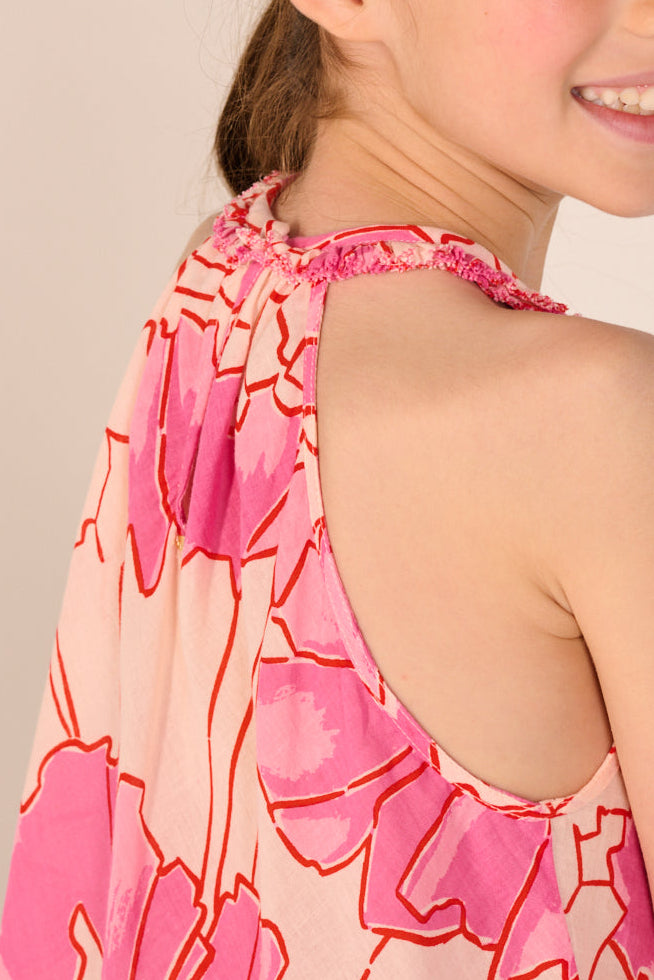 Pink Petal Mini Dress for girls by Poupette St Barth, made of cotton mousseline, featuring a sweet, flowy design.