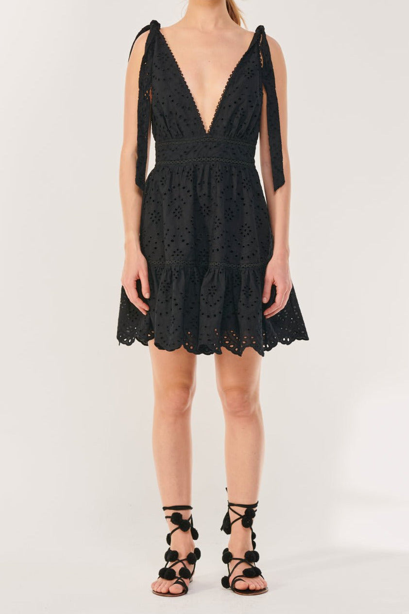 Black mini dress – Mini Dress Cara by Poupette St Barth, front view with tiered scalloped eyelet hem
