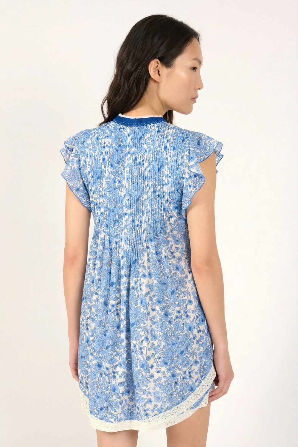 Blue Aquaflora mini dress by Poupette St Barth featuring a stylish design, showcased from the back.