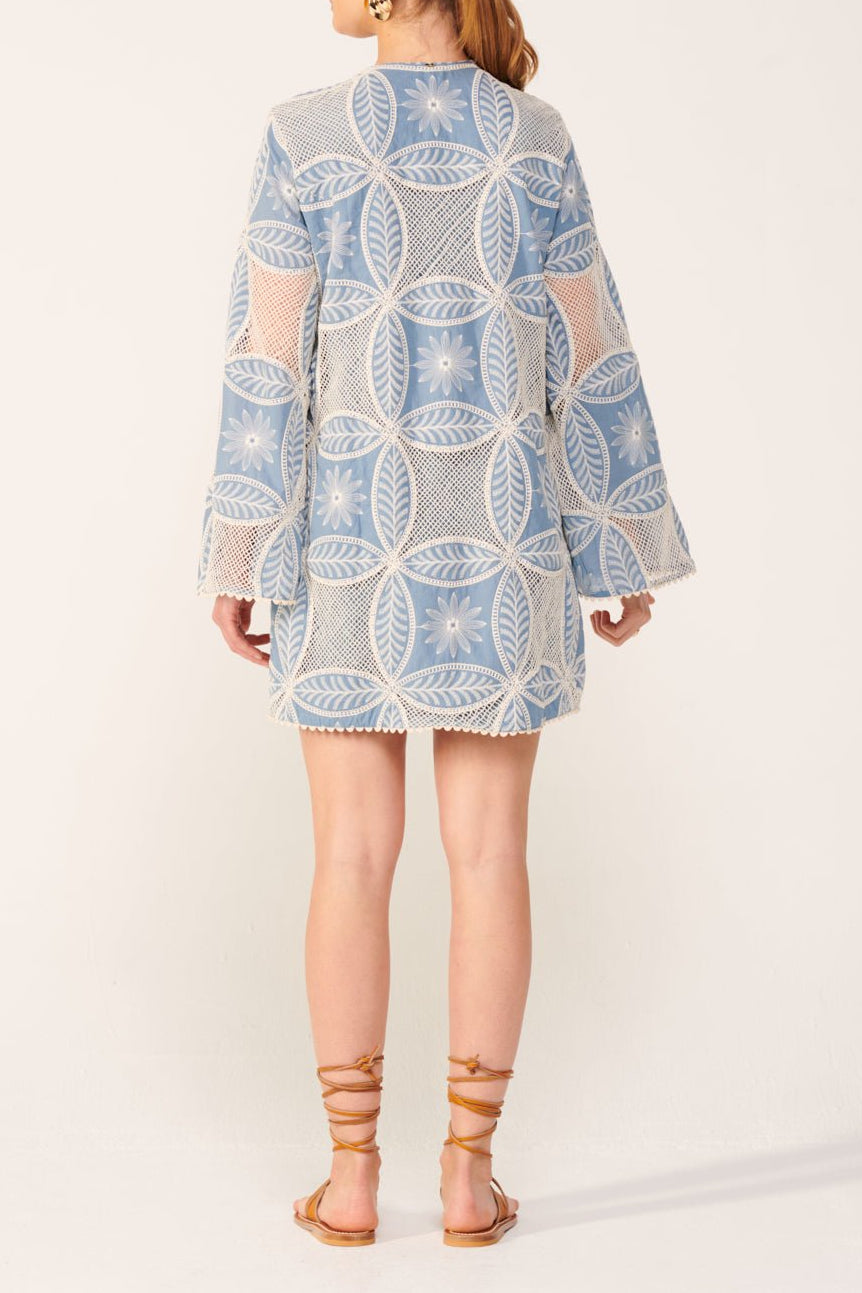 Blue Poupette St Barth Gia Mini Dress featuring eyelet cotton fabric and mandala details, perfect for casual summer wear.