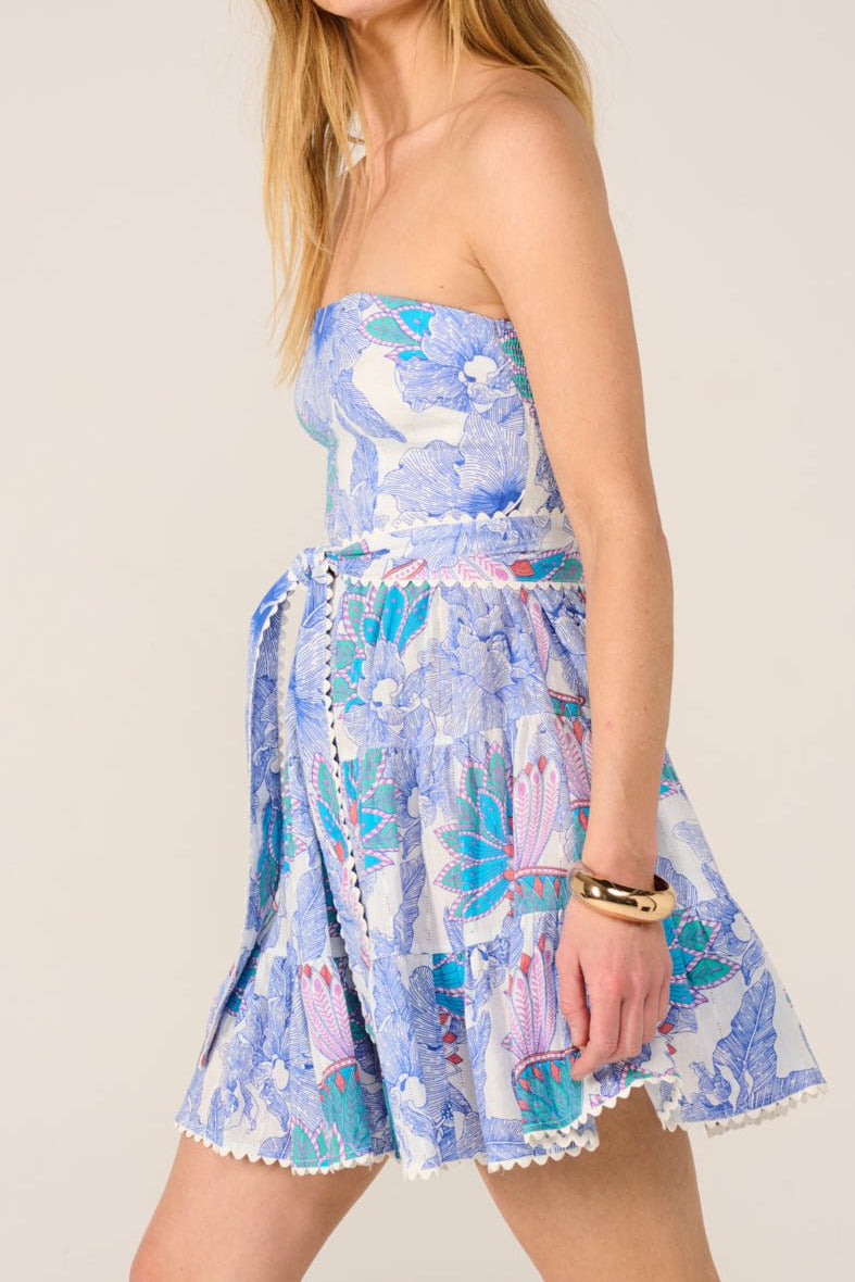 Blue Padang mini dress – Bandeau Dress Christine by Poupette St Barth, side view showing rickrack trim and tie belt