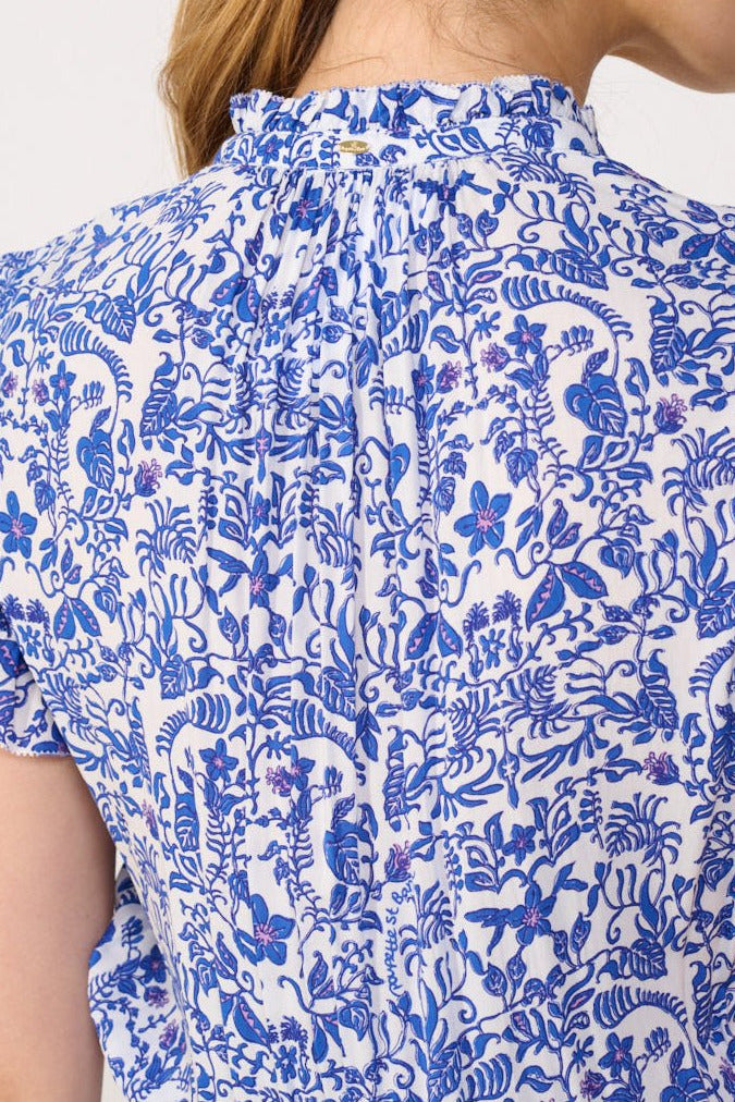 Blue Callie Mini Dress by Poupette St Barth, sleeveless viscose dress with a relaxed fit and floral pattern, displayed on a hanger.