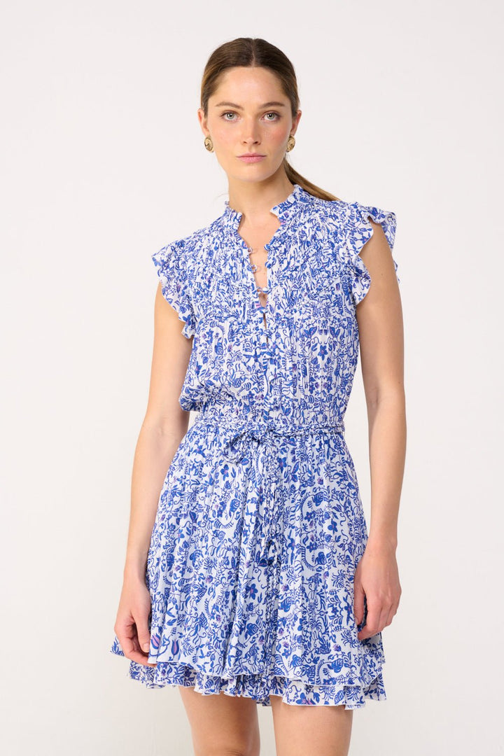 Blue Callie mini dress by Poupette St Barth, featuring lightweight fabric and stylish design, displayed on a hanger.