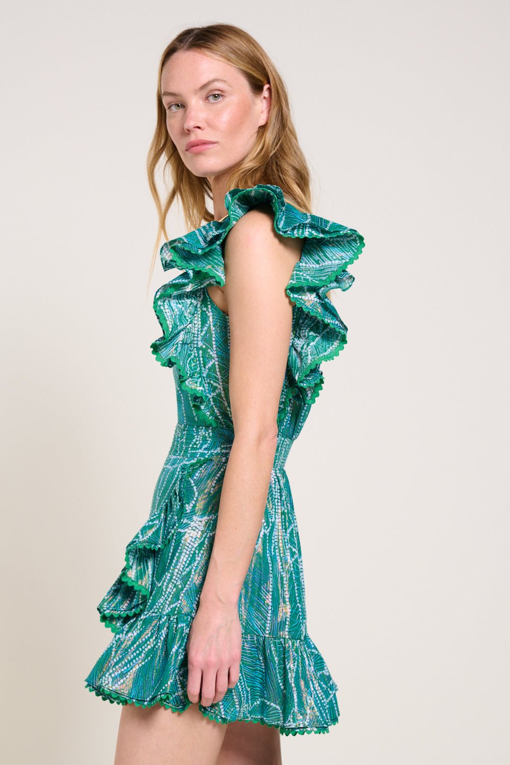 Green Mini Dress Corinne by Poupette St Barth, featuring a stylish, vibrant design perfect for summer or casual outings.