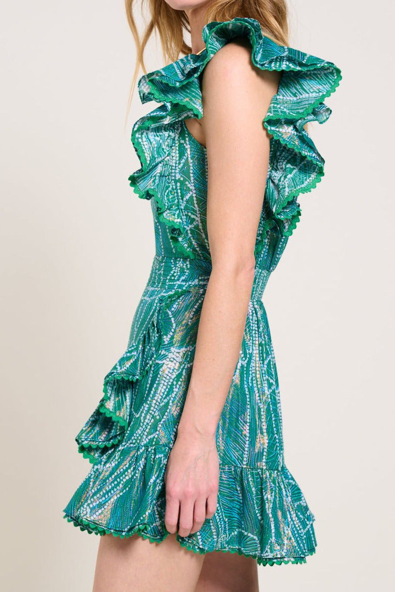 Green Akoya mini dress – Mini Dress Corinne by Poupette St Barth, side view of ruffled shoulder and tiered hem