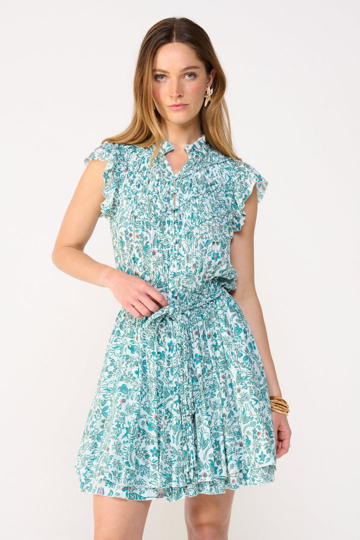 Green Callie mini dress by Poupette St Barth featuring a stylish, fitted silhouette and vibrant tropical print.