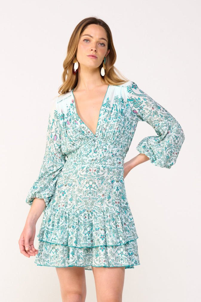 Green mini dress Chiara by Poupette St Barth featuring a stylish, fitted design and floral Tiare accents.