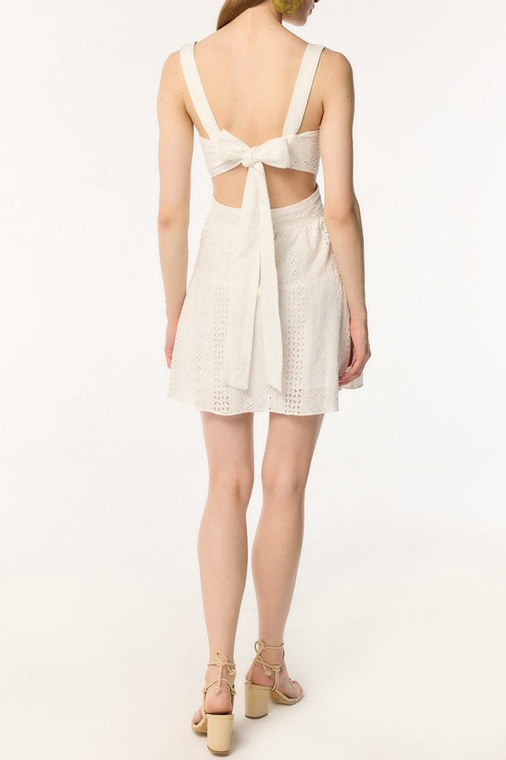 Poupette St Barth Mini Dress Coco in natural white, sleeveless with lightweight fabric, perfect for warm weather and casual outings.