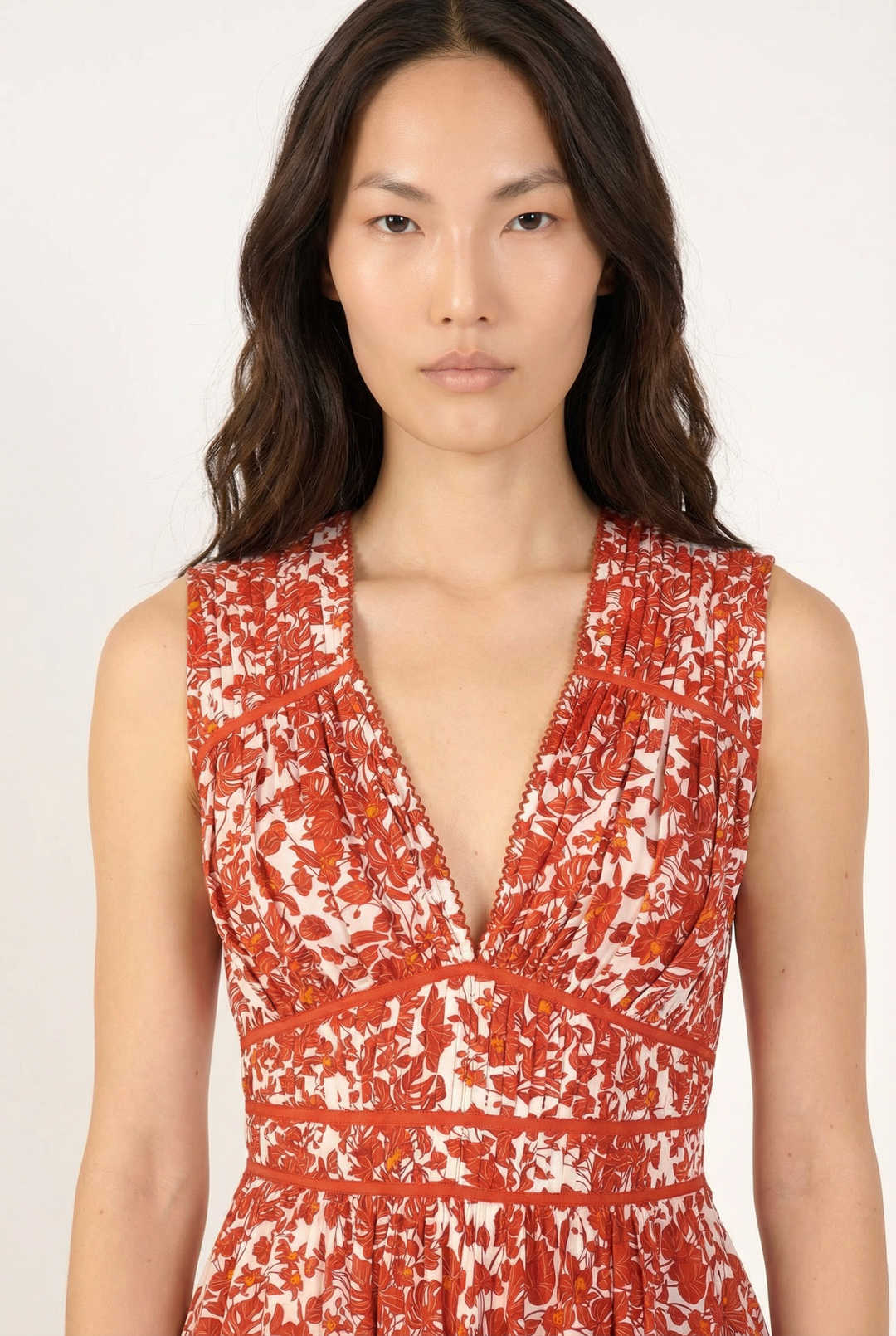 Close-up of Poupette St Barth Mini Dress Ciao in paprika aqua floral print, showing fabric details and vibrant colors.