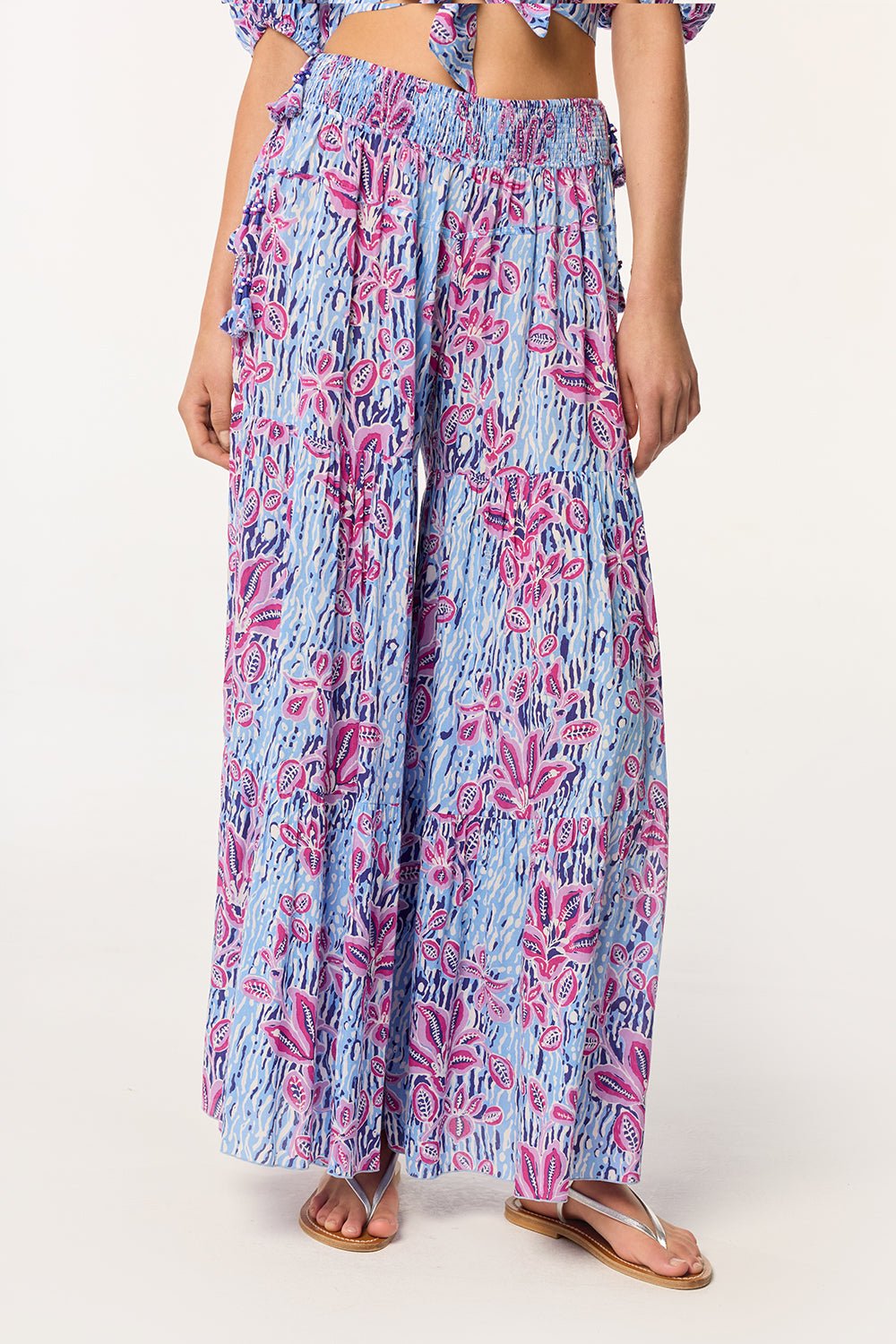 Blue viscose pants from Poupette St Barth's Soledad collection featuring an exotic forest print, relaxed fit and stylish design.