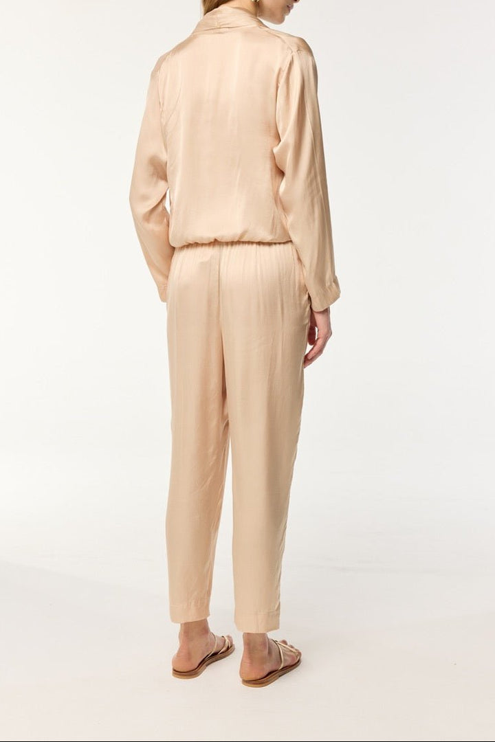 Beige Poupette St Barth Pant Celie made of lightweight fabric with a relaxed fit and high waist, shown on a model.