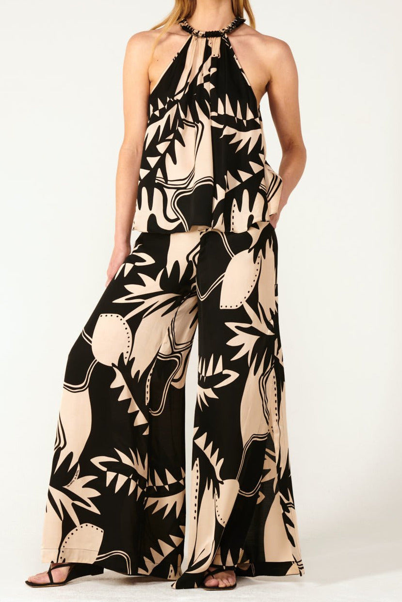 Black Oasis viscose satin pants from Poupette St Barth, featuring a relaxed fit and elegant design.