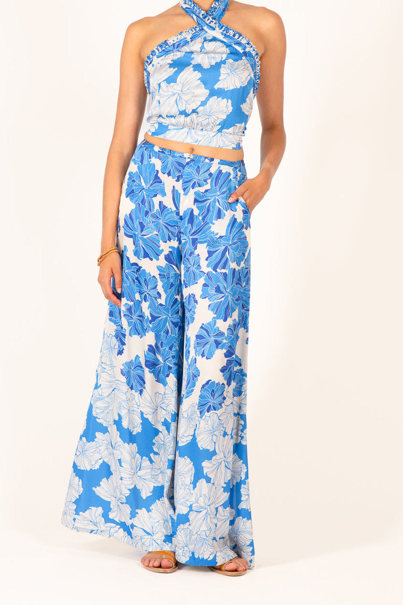 Blue floral print viscose satin pants, Poupette St Barth Pant Clea, featuring a relaxed fit with a vibrant flower bunch design.