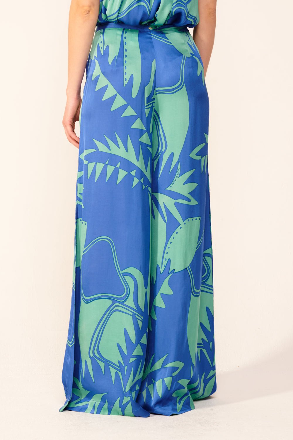 Blue Oasis Pant Clea by Poupette St Barth, featuring lightweight fabric and relaxed fit, displayed on a hanger.
