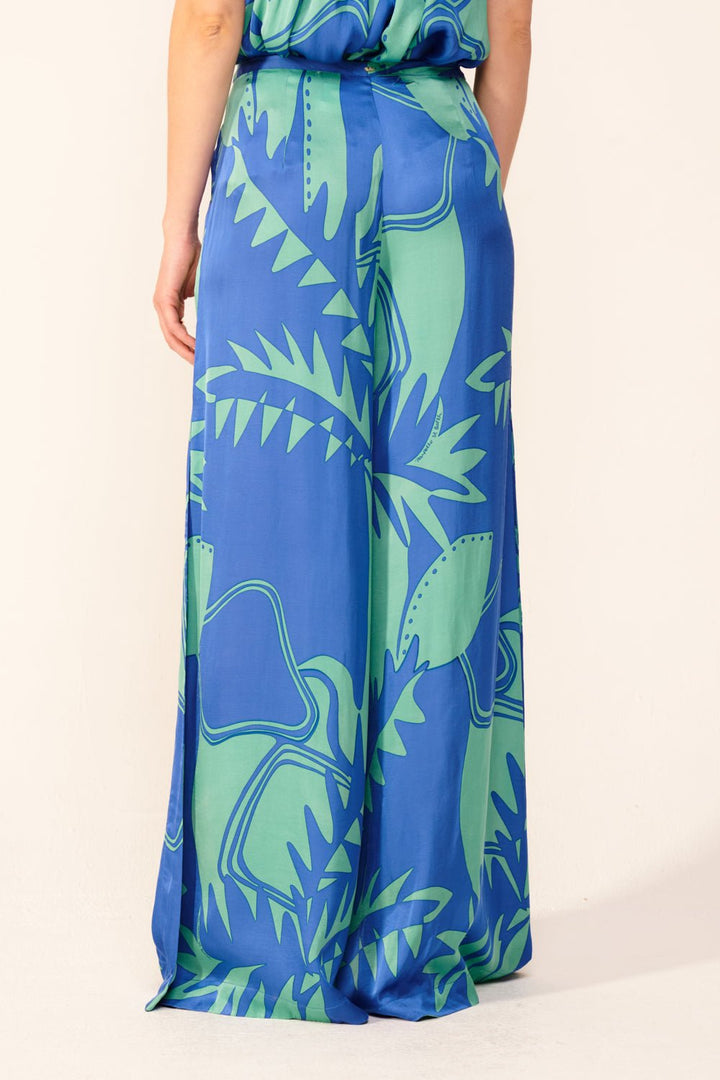 Blue Oasis Pant Clea by Poupette St Barth, featuring lightweight fabric and relaxed fit, displayed on a hanger.