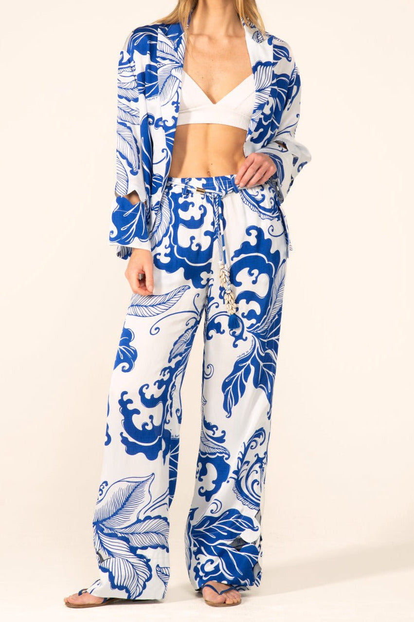 Blue Reef Wave Pant Patti by Poupette St Barth, lightweight satin pants in blue with relaxed fit, shown in a cropped view.