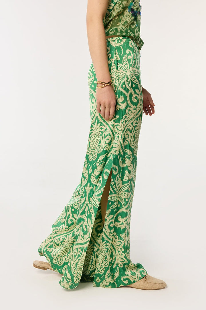 Green macro ikat pants from Poupette St Barth, featuring a relaxed fit and vibrant pattern, perfect for casual summer wear.