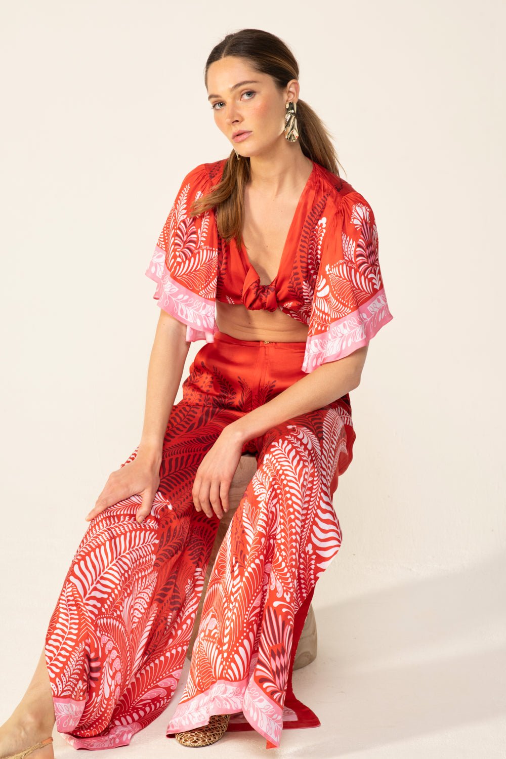 Poupette St Barth orange Oolong pants with a relaxed fit, featuring lightweight fabric and stylish design.