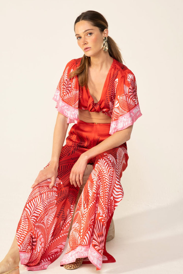 Poupette St Barth orange Oolong pants with a relaxed fit, featuring lightweight fabric and stylish design.