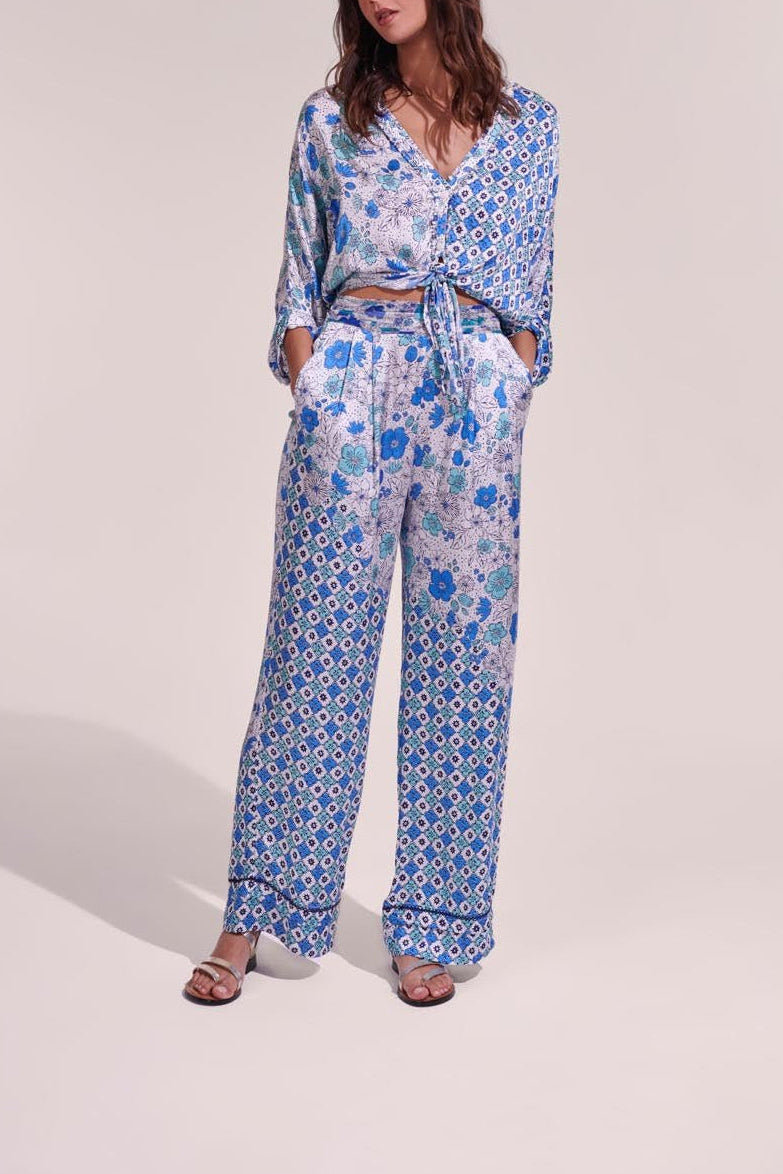 White and green diagonal batik pants from Poupette St Barth, featuring a stylish and lightweight design.