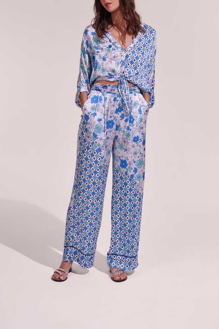 White and green diagonal batik pants from Poupette St Barth, featuring a stylish and lightweight design.
