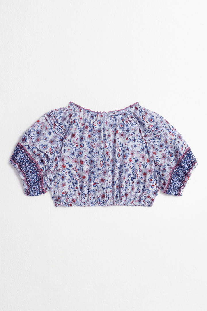 Back view of Poupette St Barth Kids Top Andrea in Blue Magnolia, a stylish children's shirt with a casual design.